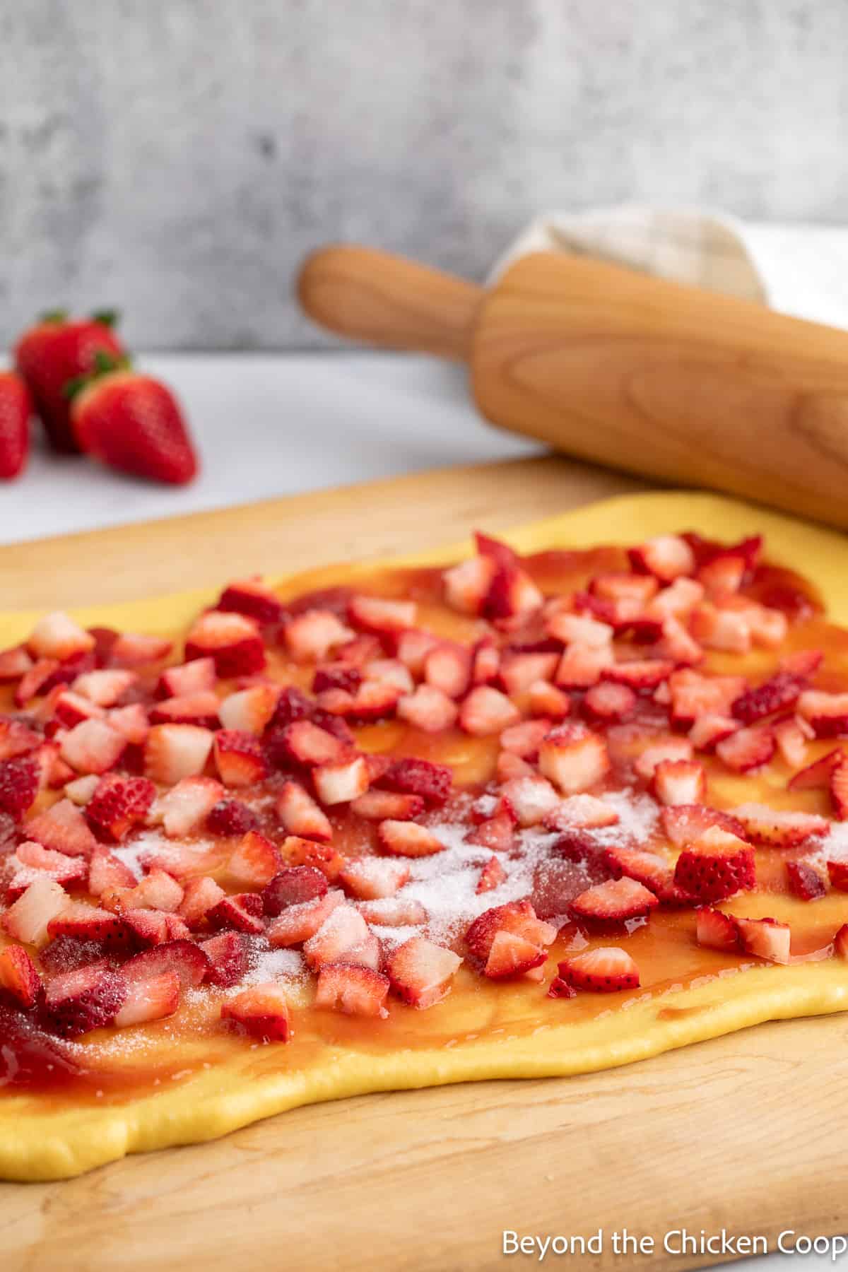 Cut strawberries on top of rolled out dough. 