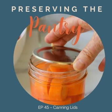 A canning lid on a jar of carrots.