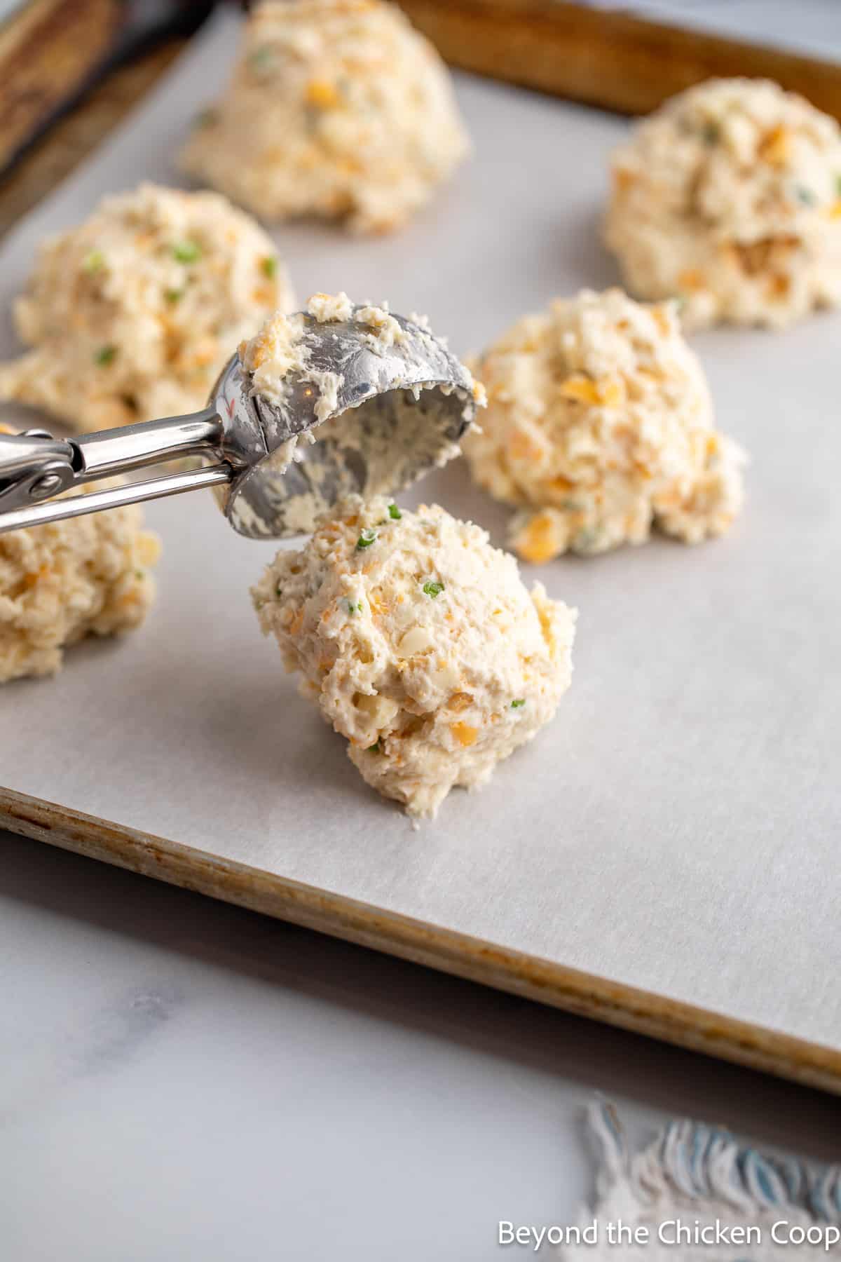 Forming biscuits with a large scoop. 