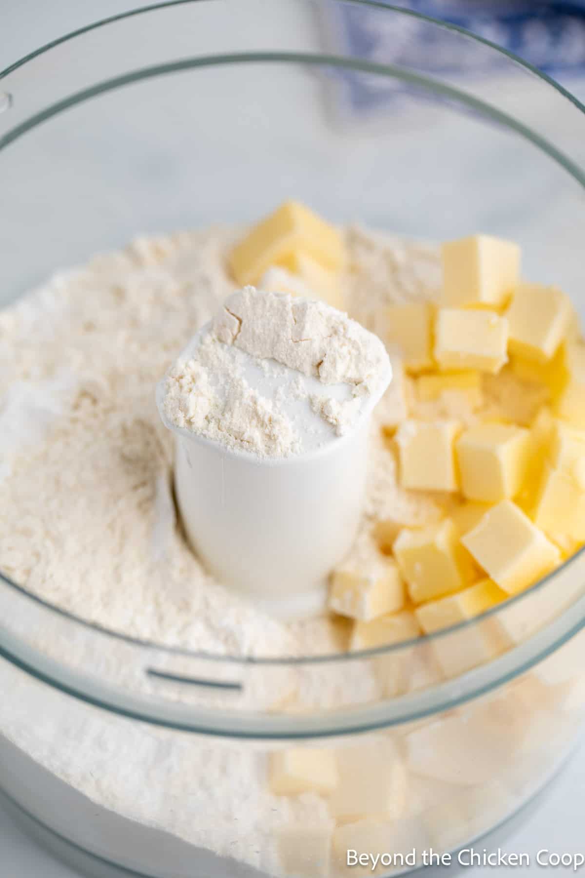 Flour and butter in a food processor. 