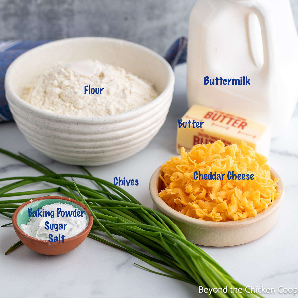 Ingredients for making biscuits with chives and cheese. 