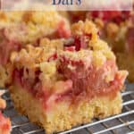 Rhubarb bars on a baking rack.