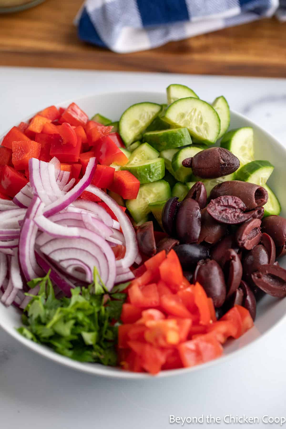 Cut veggies in a large bowl. 