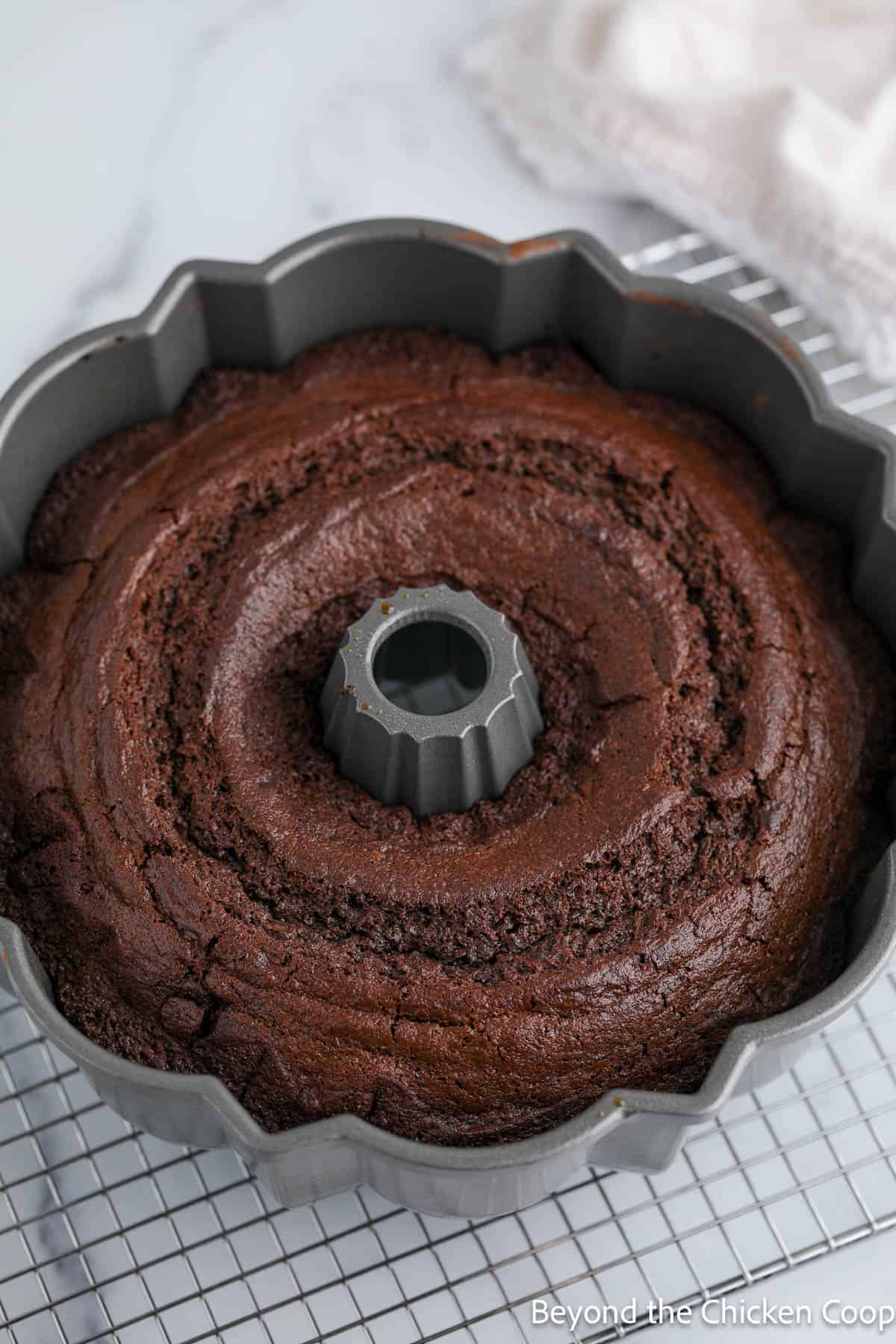 A baked chocolate bundt cake in the pan.