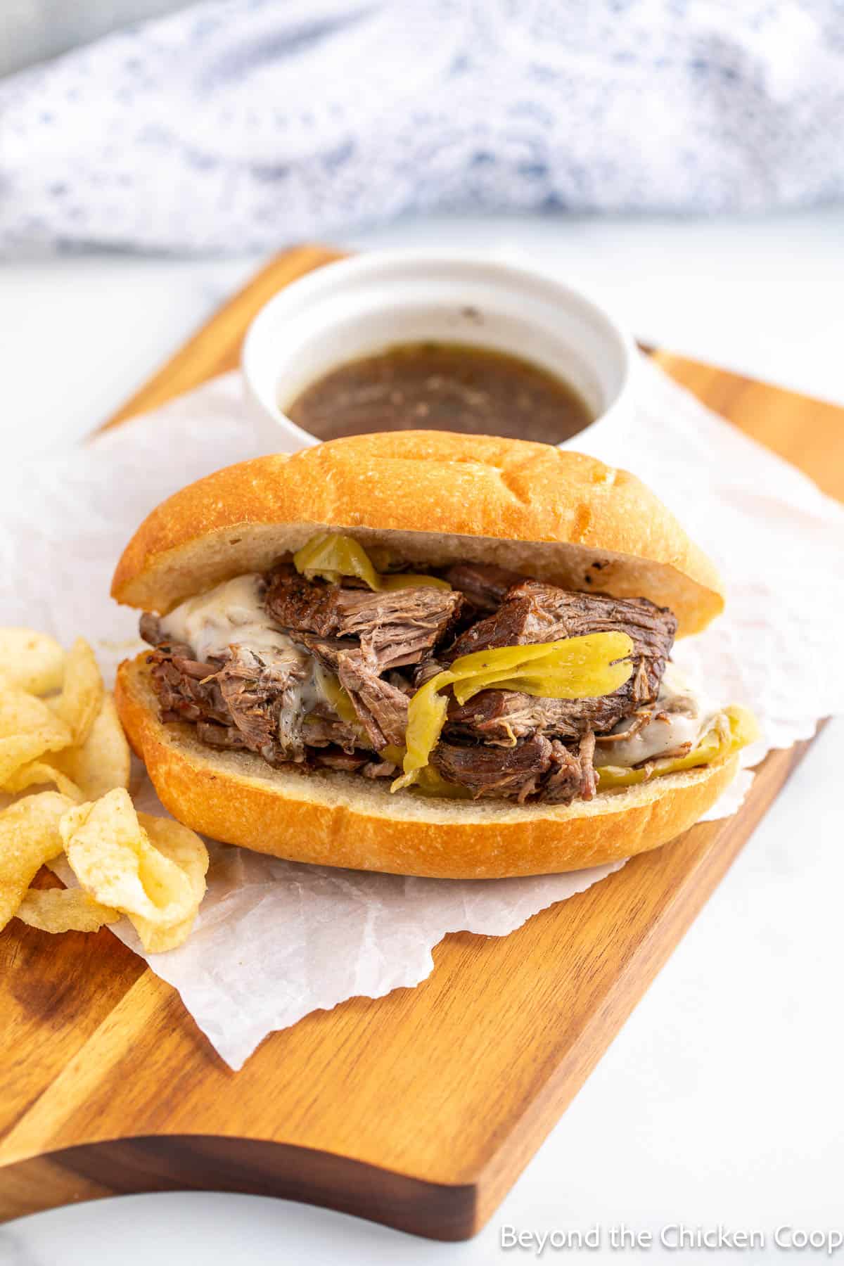 An Italian beef sandwich on a board. 