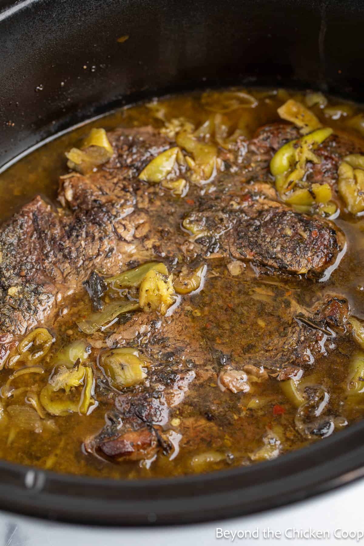 Cooked chuck roast in a crock pot. 