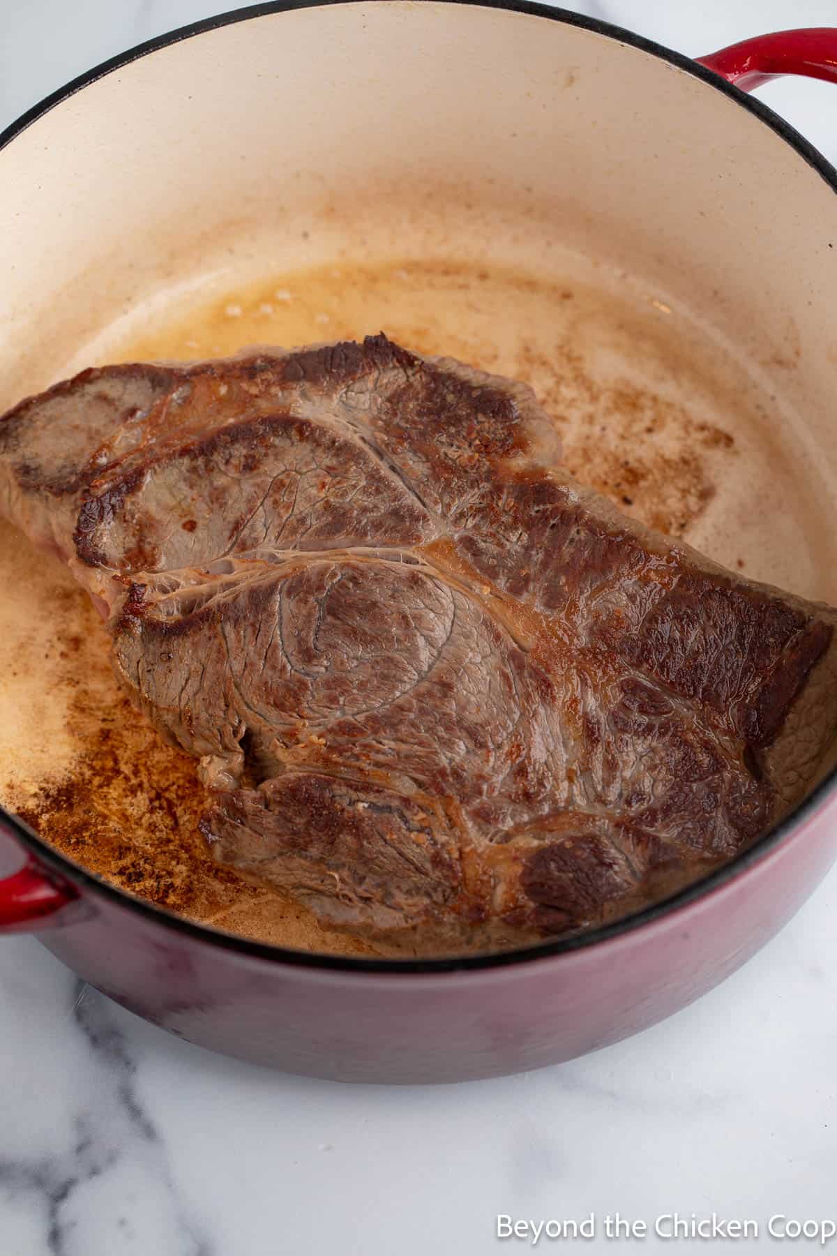 Browning a chuck roast in a pot. 