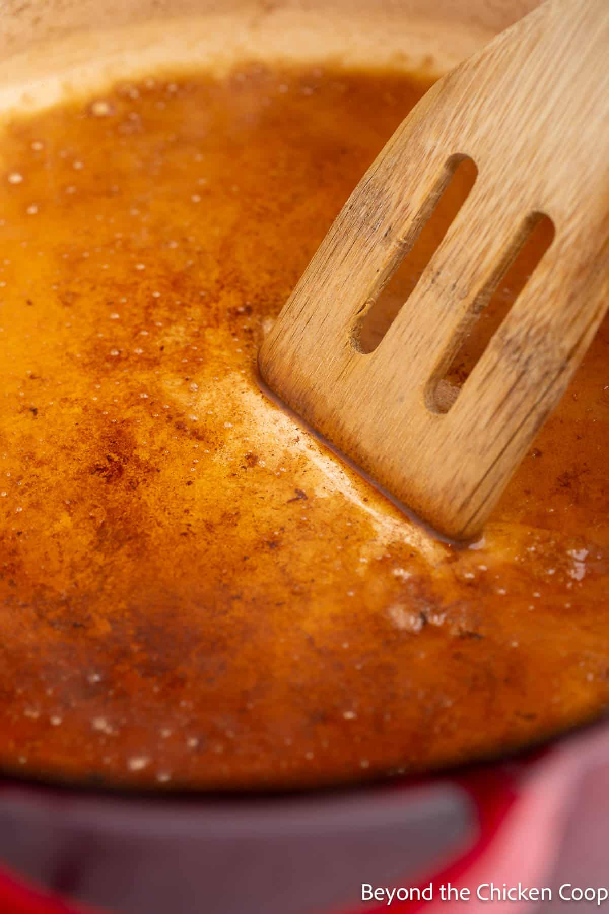 Deglazing a pan with broth. 