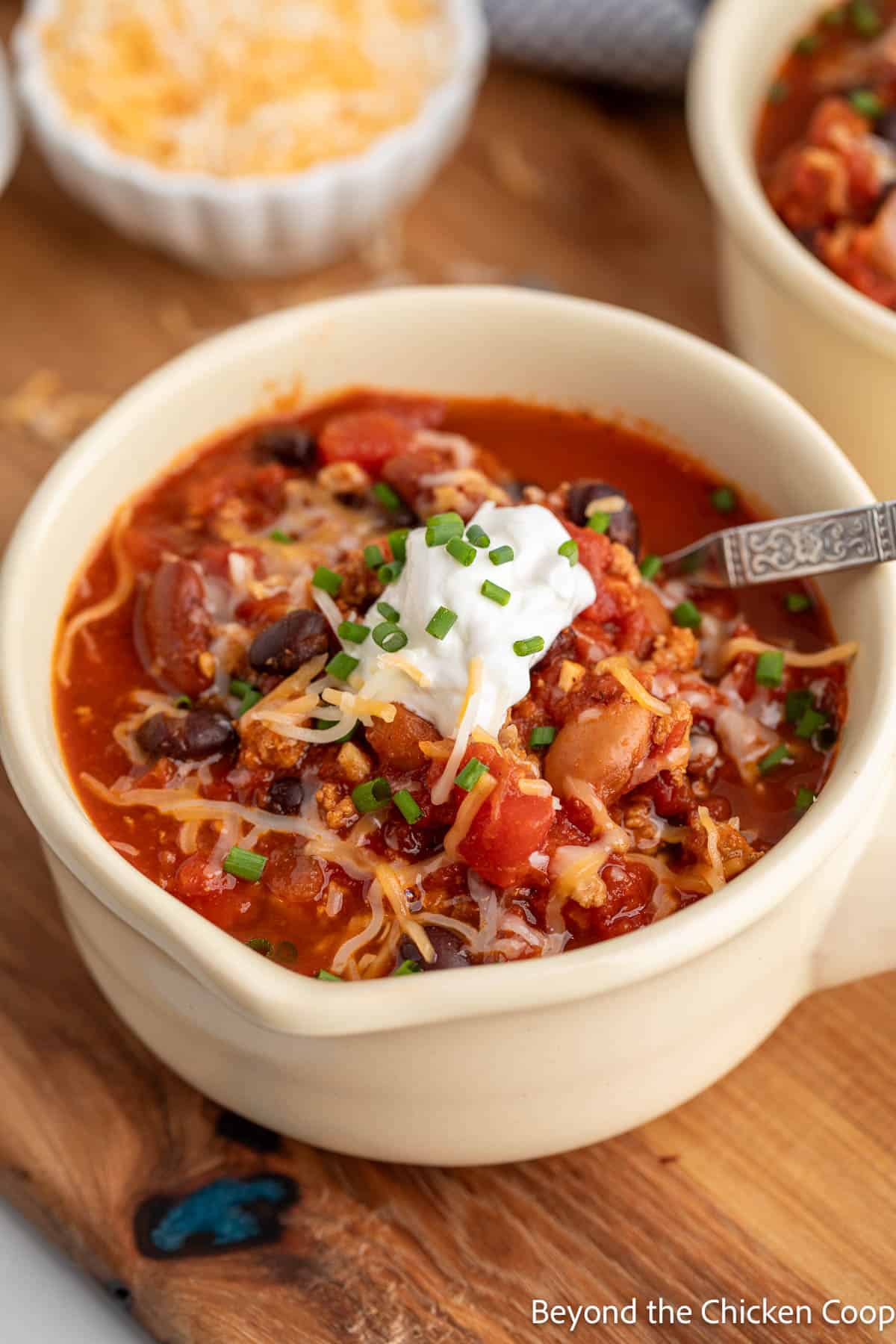 Chili in a tan bowl.