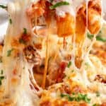 A cheesy pull from a baked rigatoni with sausage.
