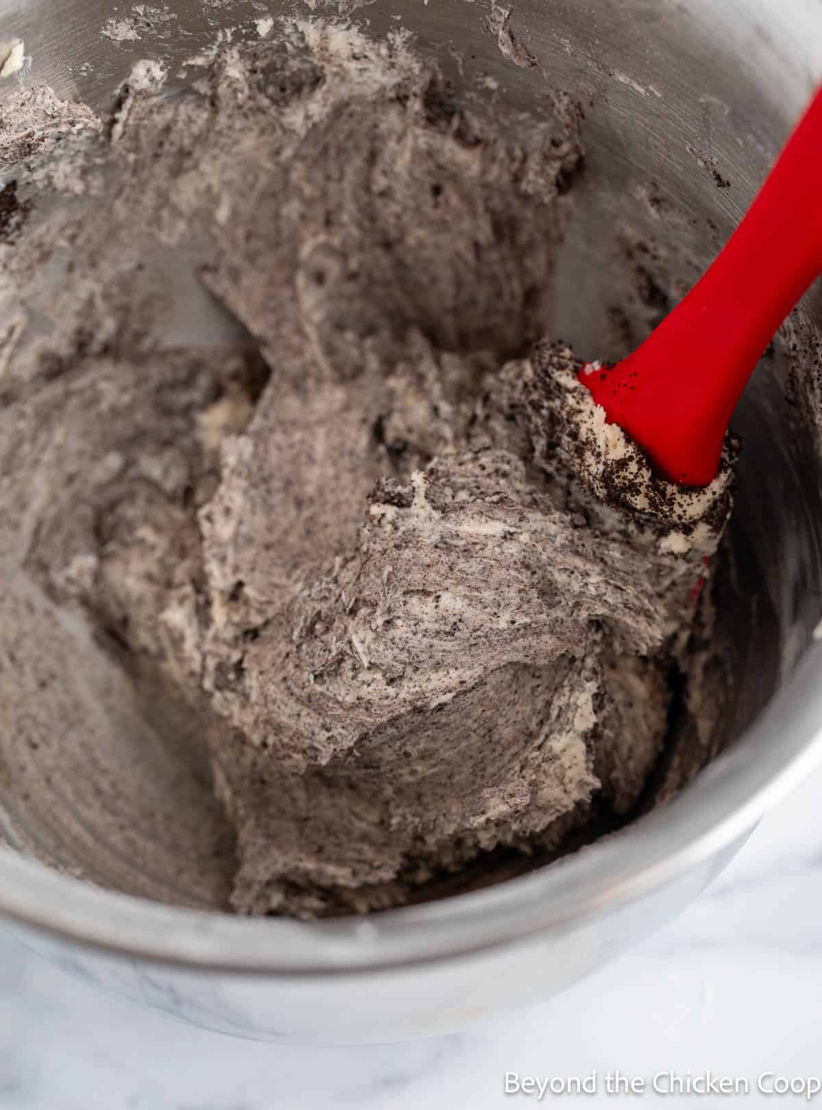 Mixed oreo icing in a large mixing bowl. 