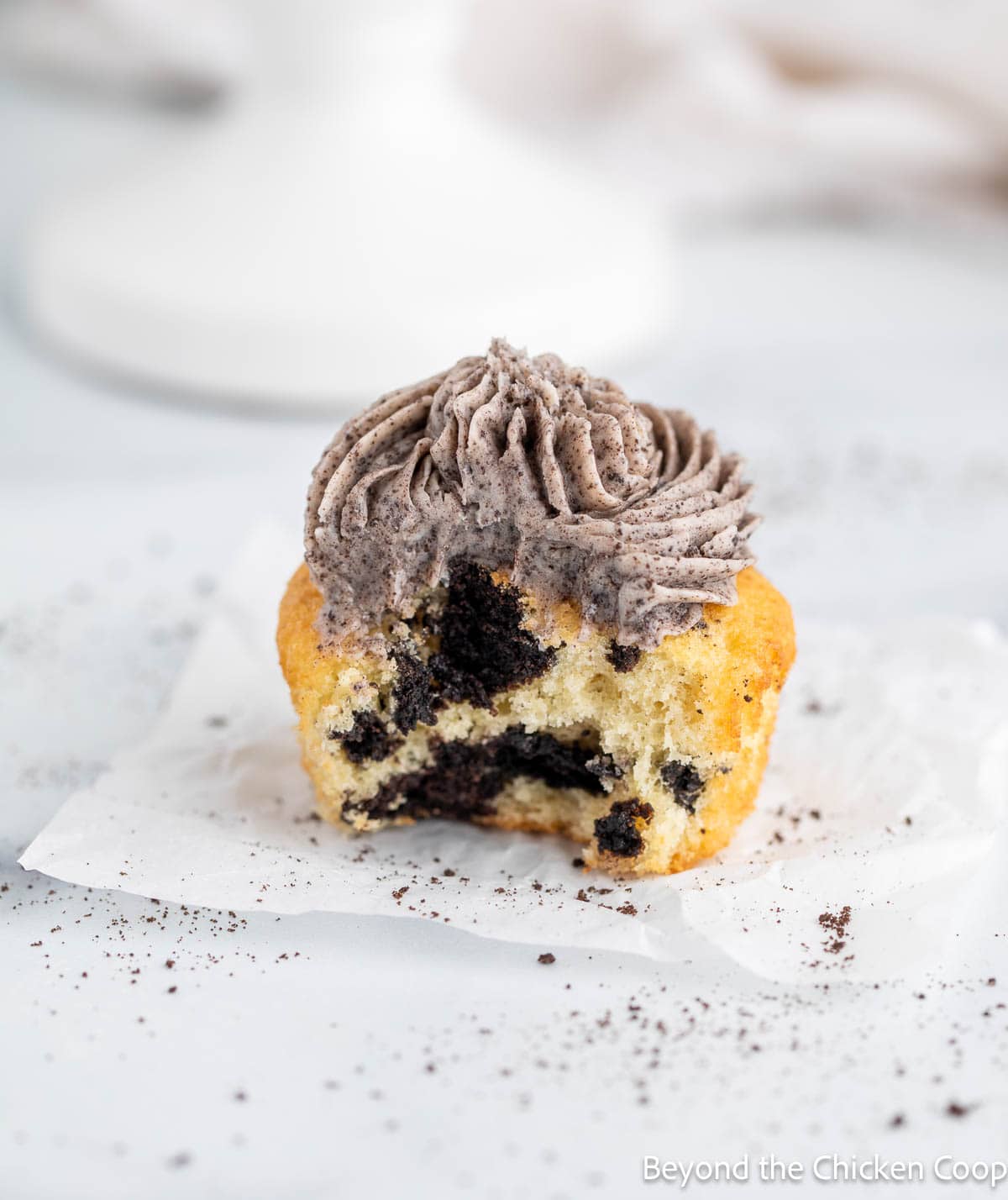 A bite out of an Oreo cupcake. 