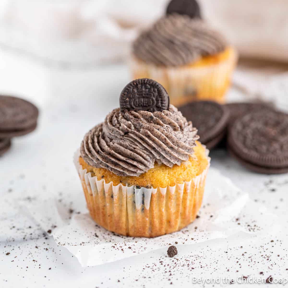 Oreo cupcakes topped with a swirl of frosting. 