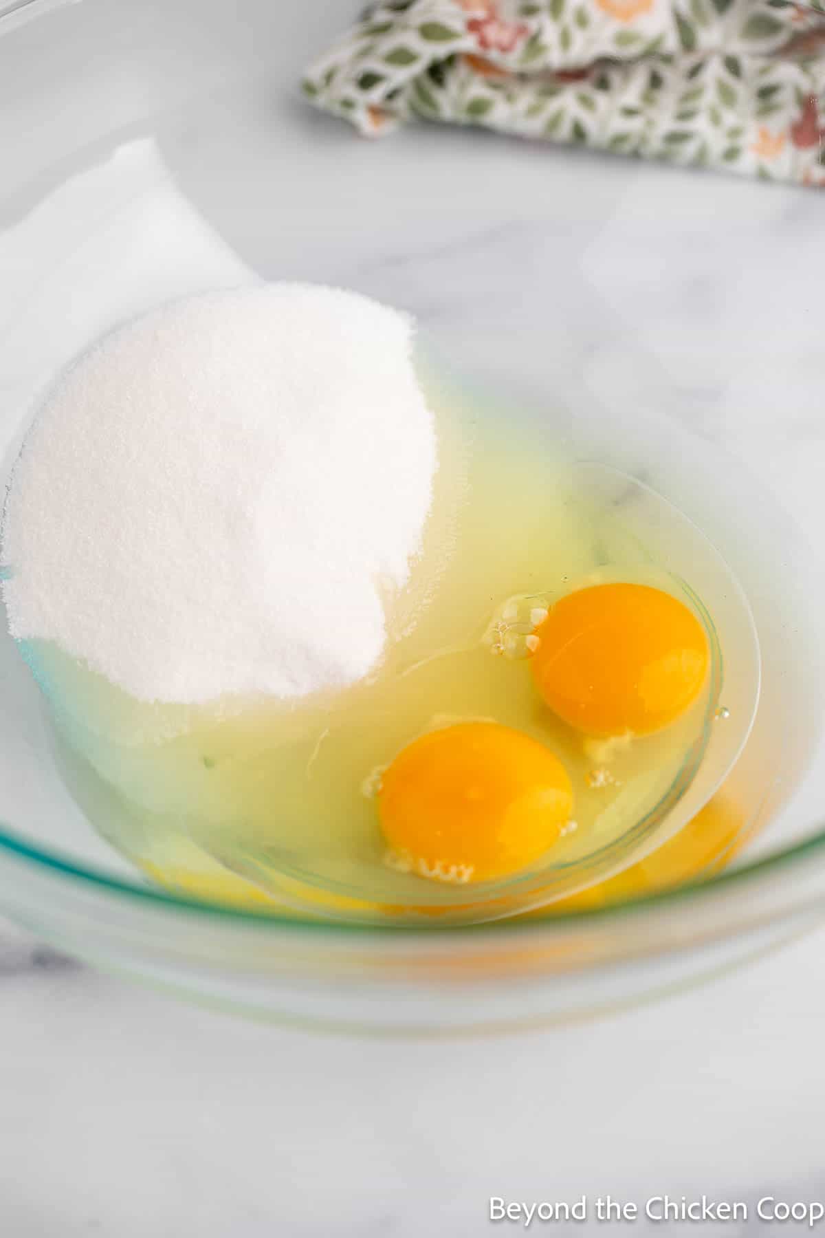 Eggs and sugar together in a bowl.