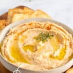 A bowl filled with white bean dip.