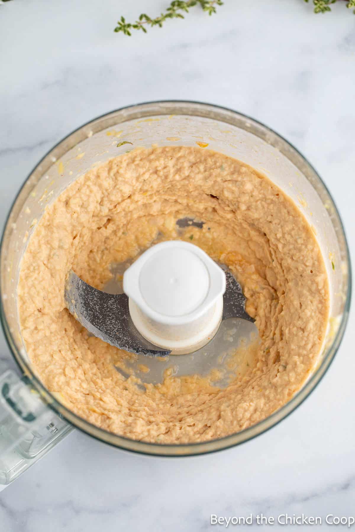 Pureed bean dip in a food processor. 