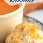 Cheese and Ham Biscuits next to a bowl of tomato soup.