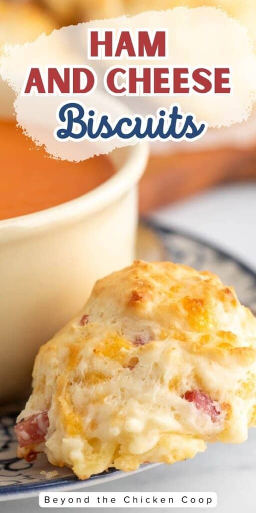 Cheese and Ham Biscuits next to a bowl of tomato soup.