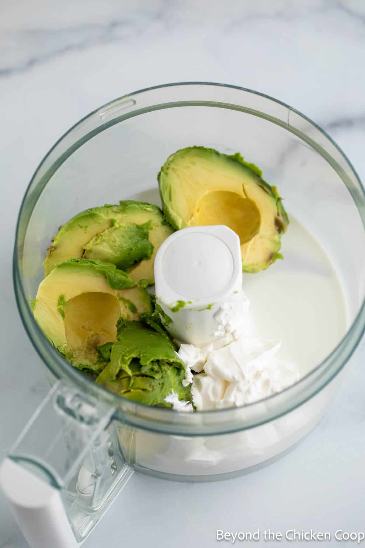 Avocados in a food processor. 