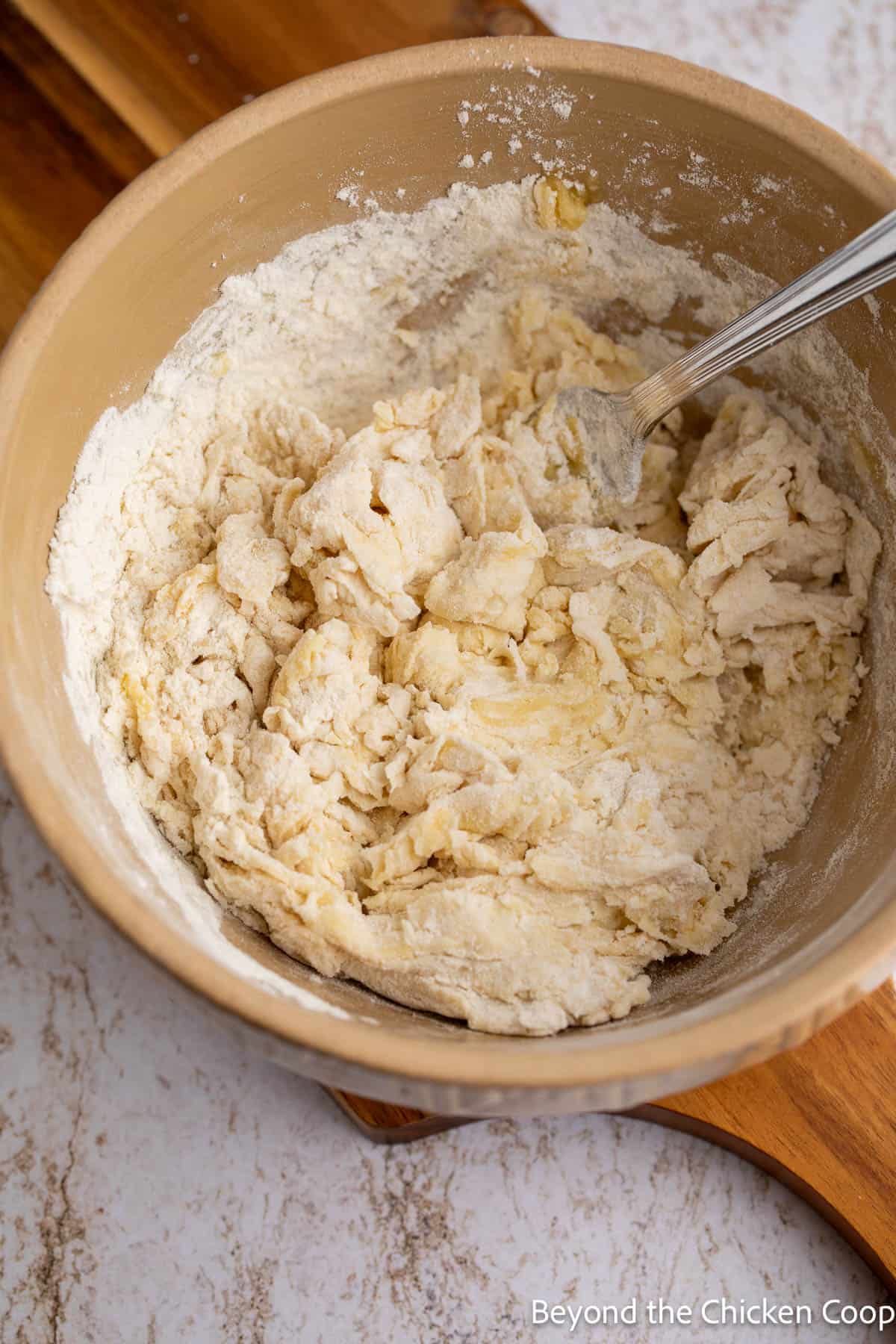 Cracker dough being mixed in a bowl. 