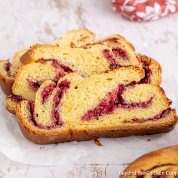 Slices of Cranberry Walnut Bread with swirls of cranberries.