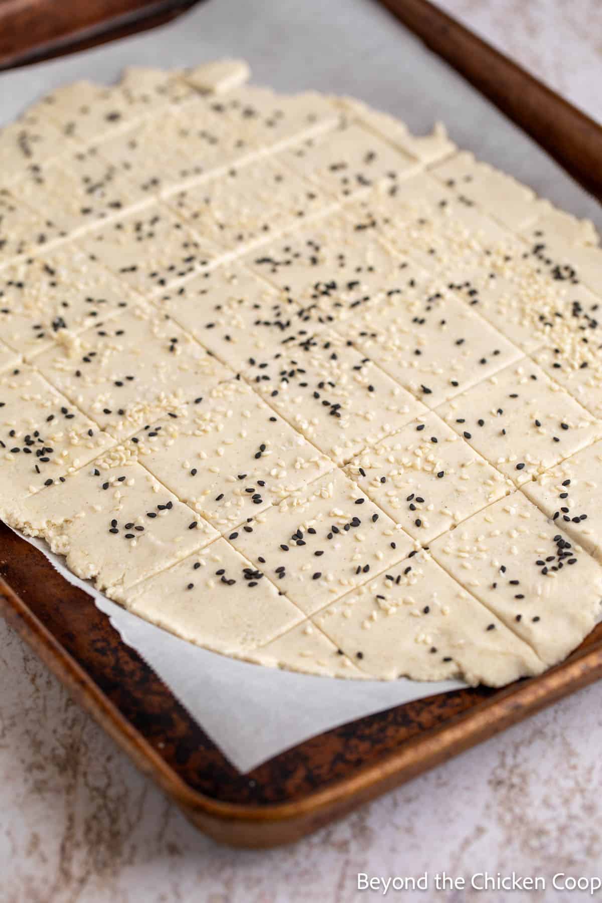 Gluten-free cracker dough on a baking sheet. 
