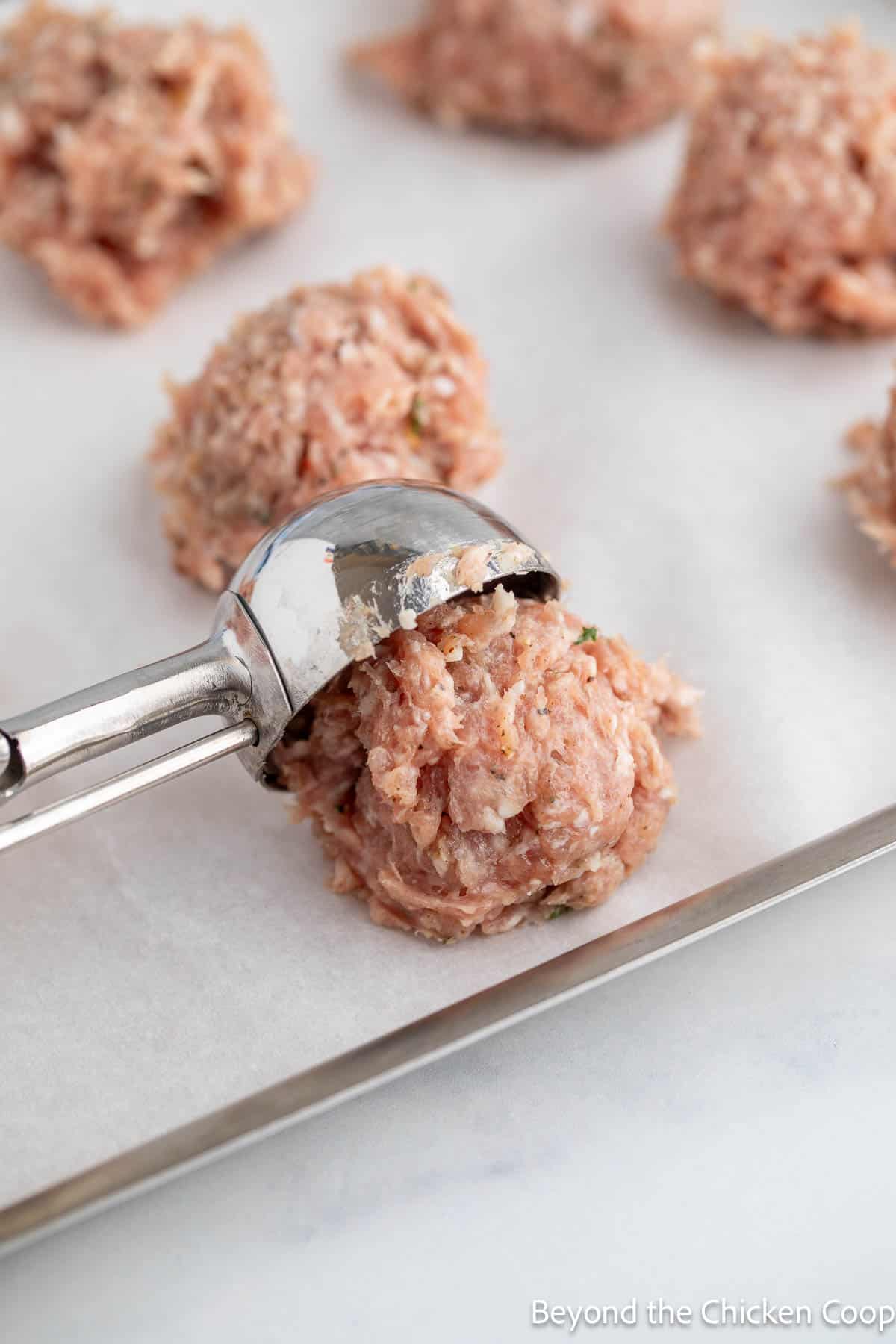Forming balls with a cookie scoop.