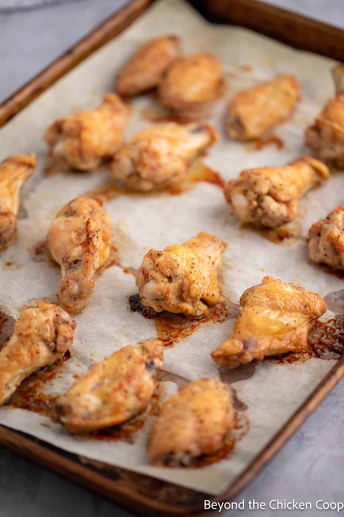 Baked wings on a baking sheet. 