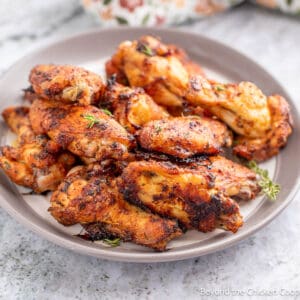 A plate filled with Dry Rubbed Wings.