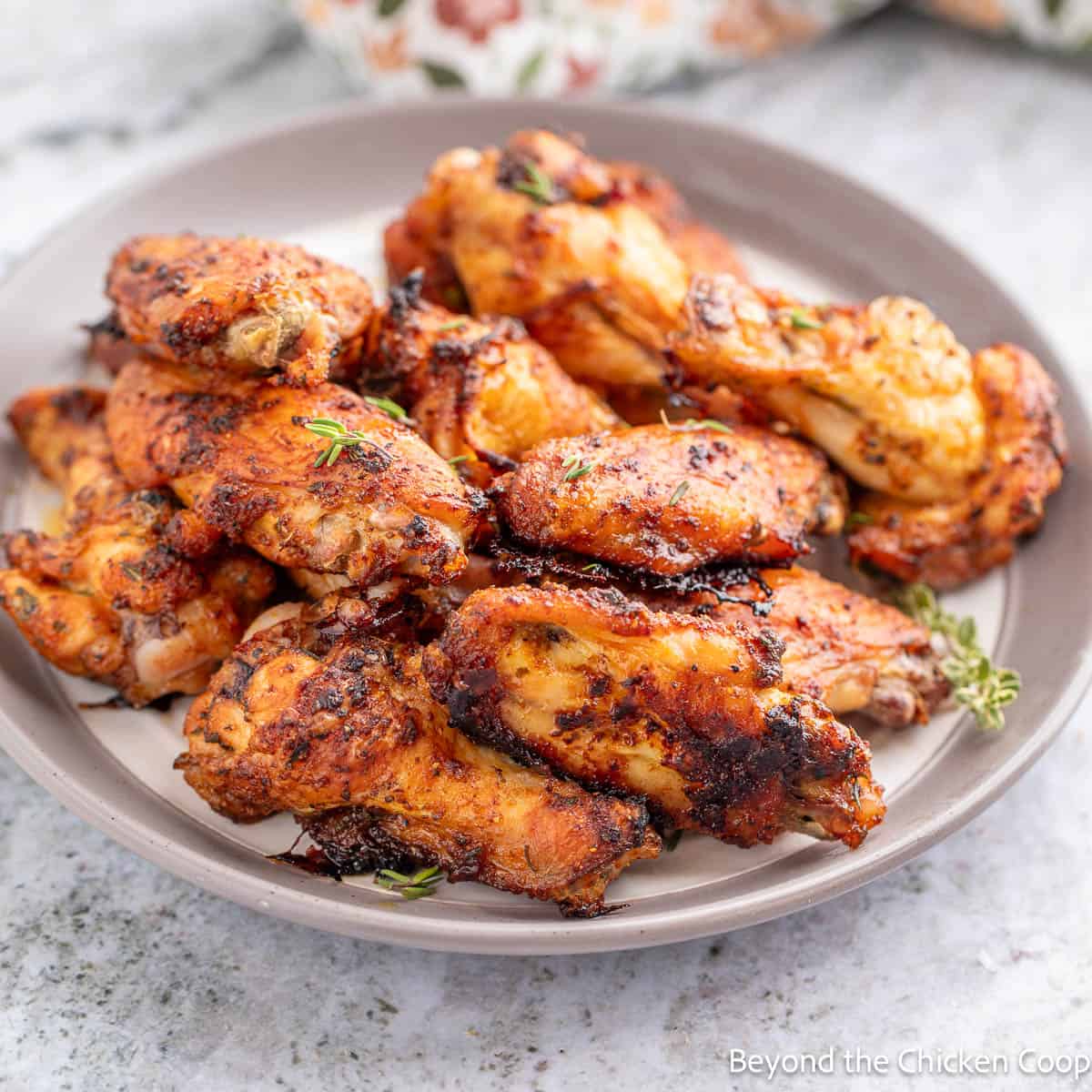 A plate filled with Dry Rubbed Wings. 