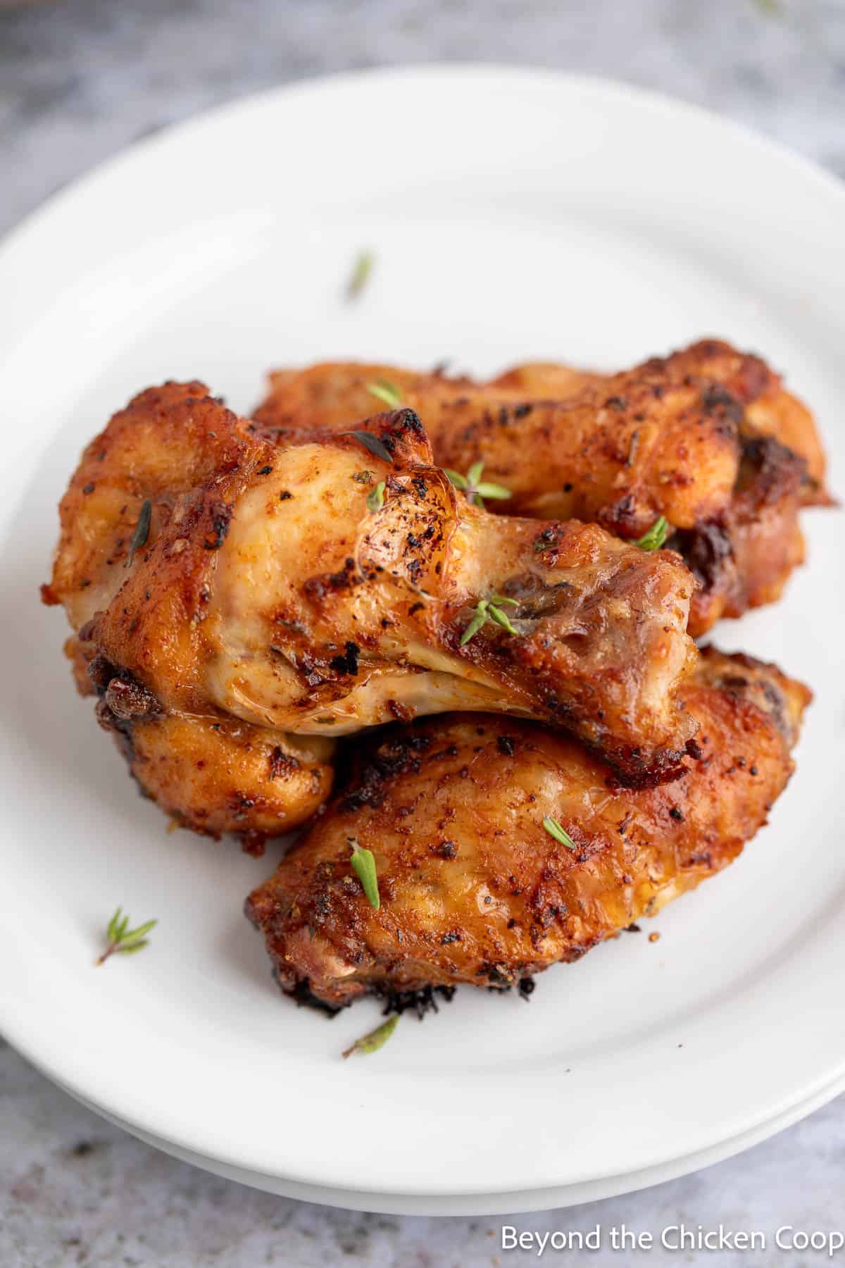 Seasoned wings on a white plate. 