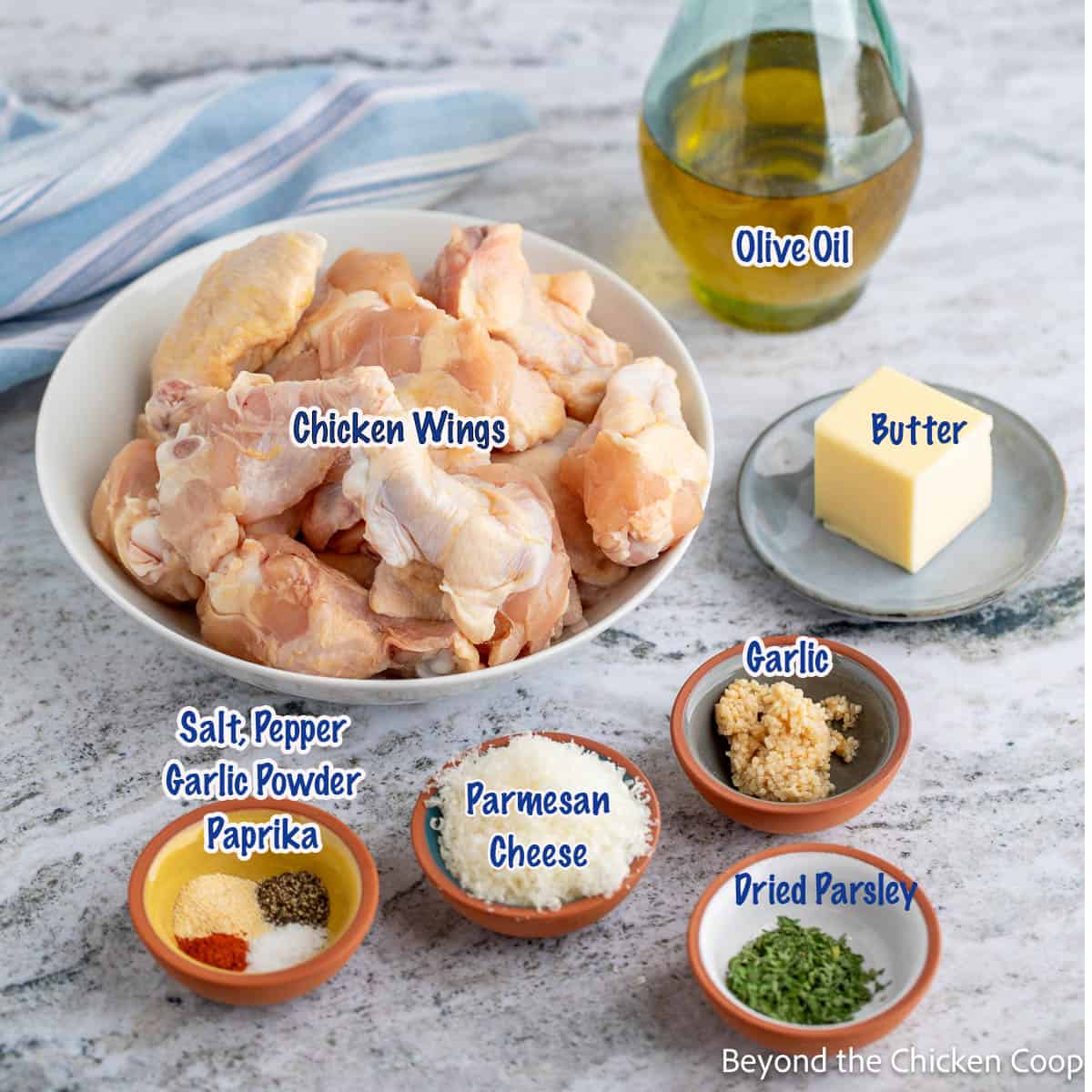 Ingredients for making baked wings with garlic and parmesan.