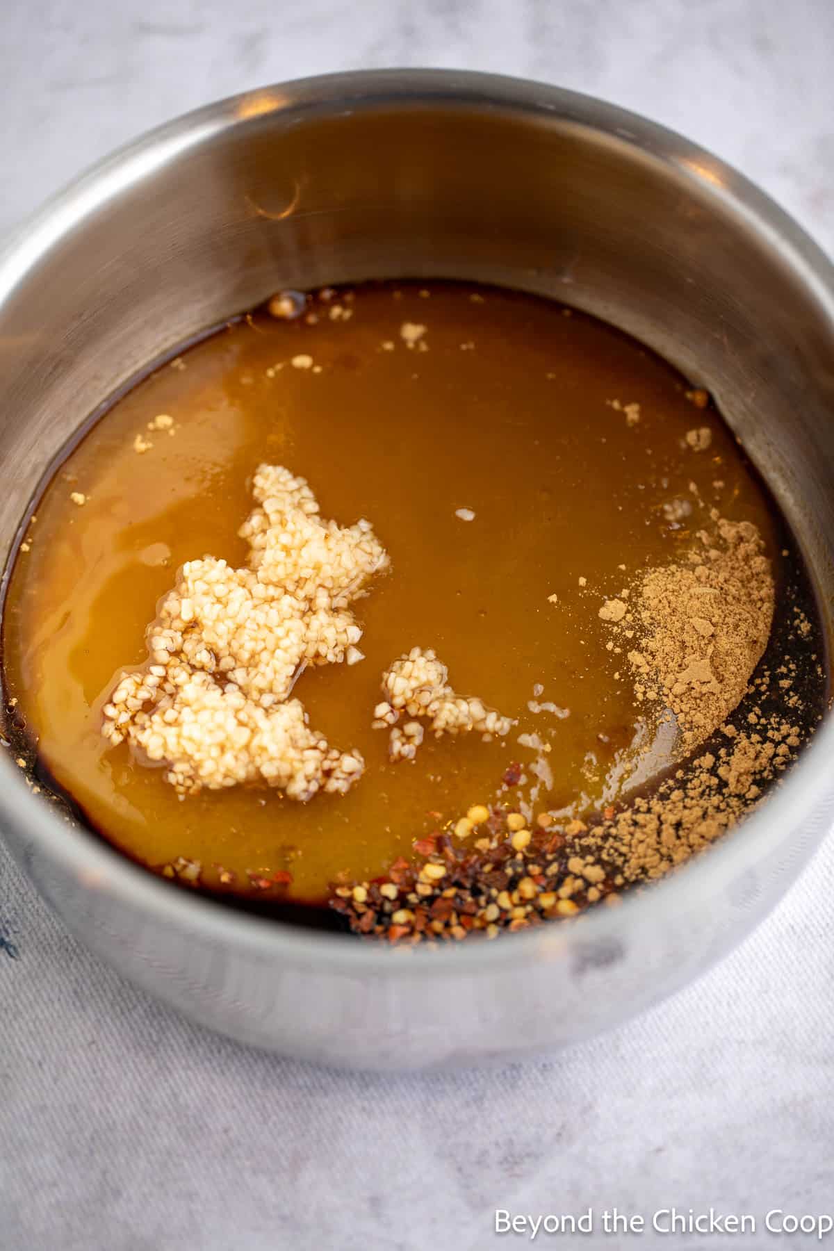 Honey garlic sauce in a small pan. 