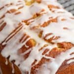 A loaf cake topped with a drizzled glaze.