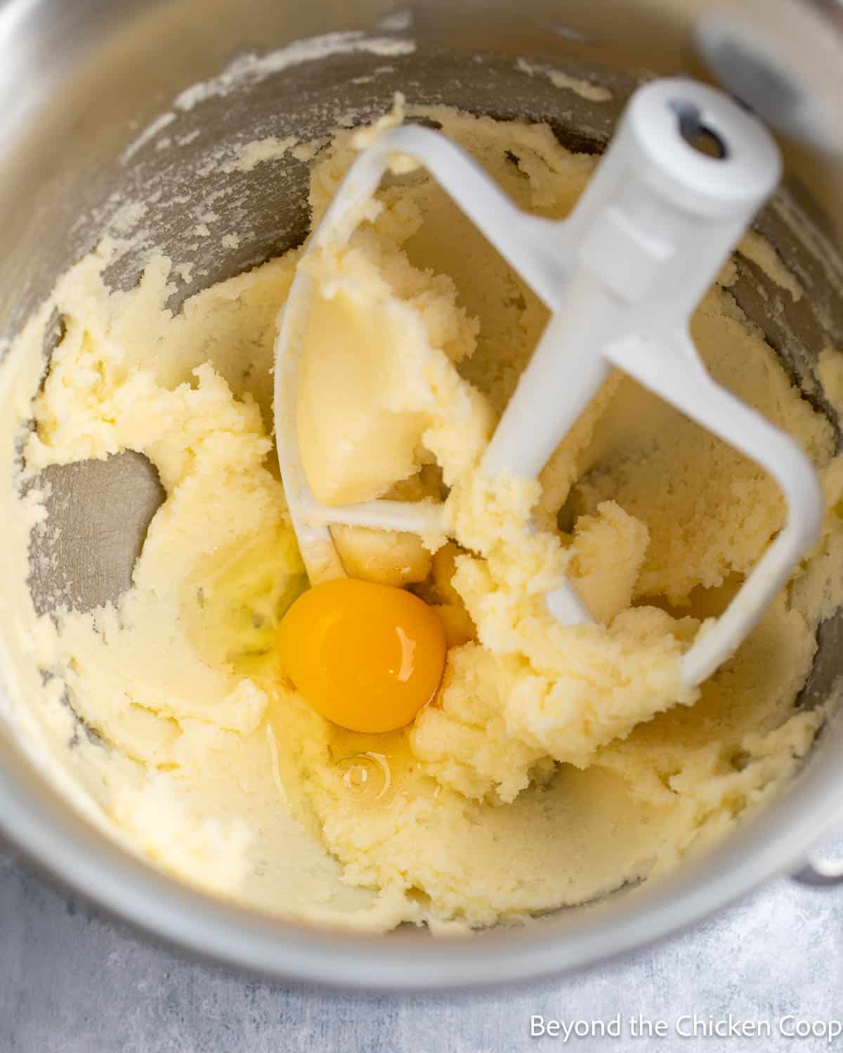 Mixing cake batter in a mixing bowl. 