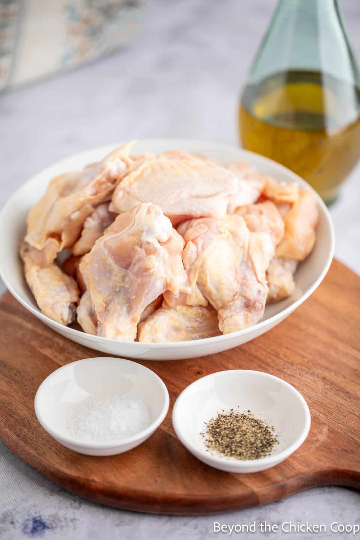 Uncooked chicken wings in a bowl. 