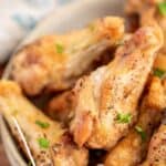 Baked chicken wings in a bowl.