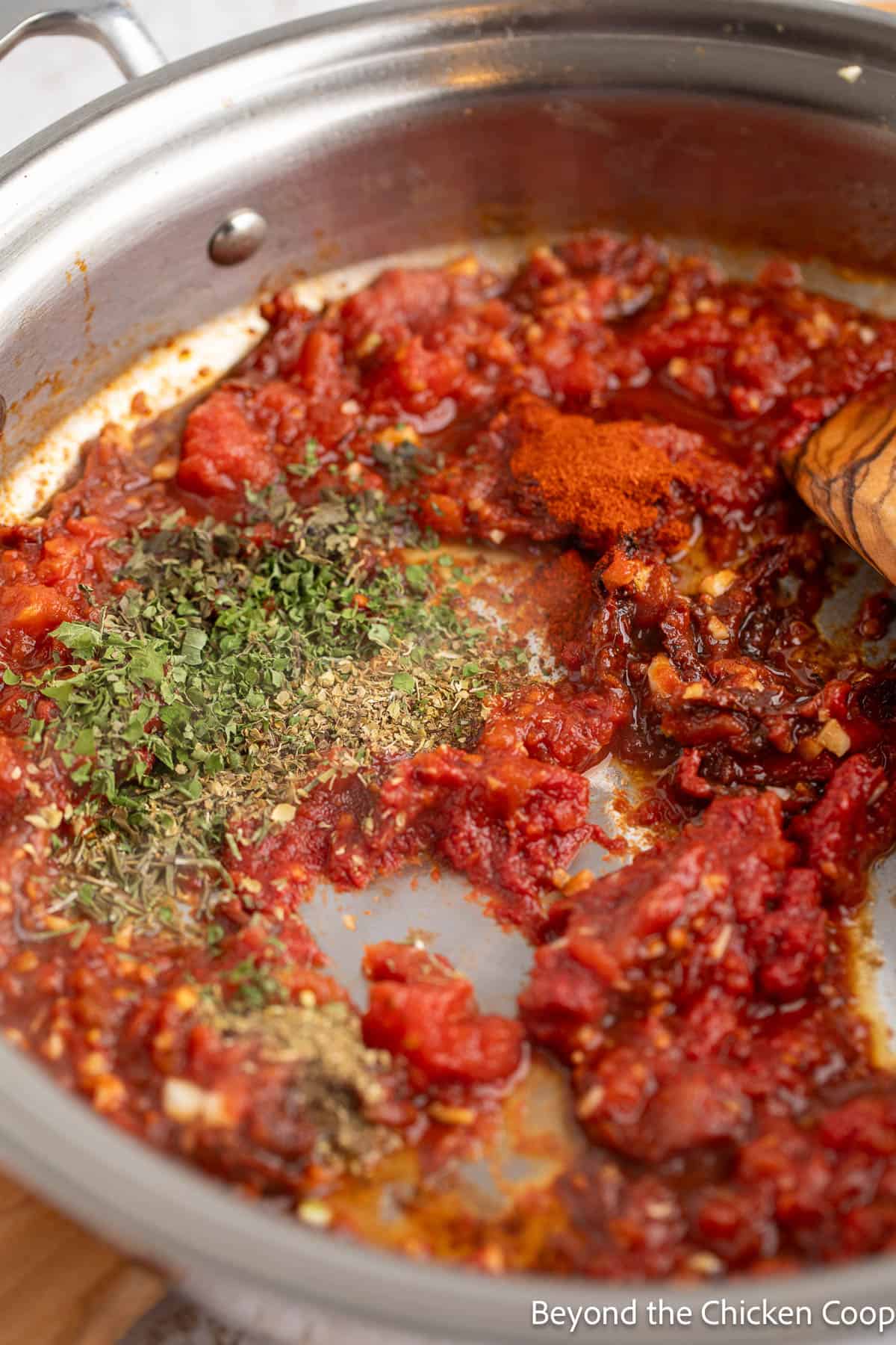 Making a tomato sauce in a large pan. 