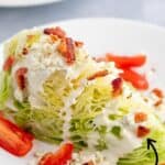 A wedge salad with chopped tomatoes and bacon.