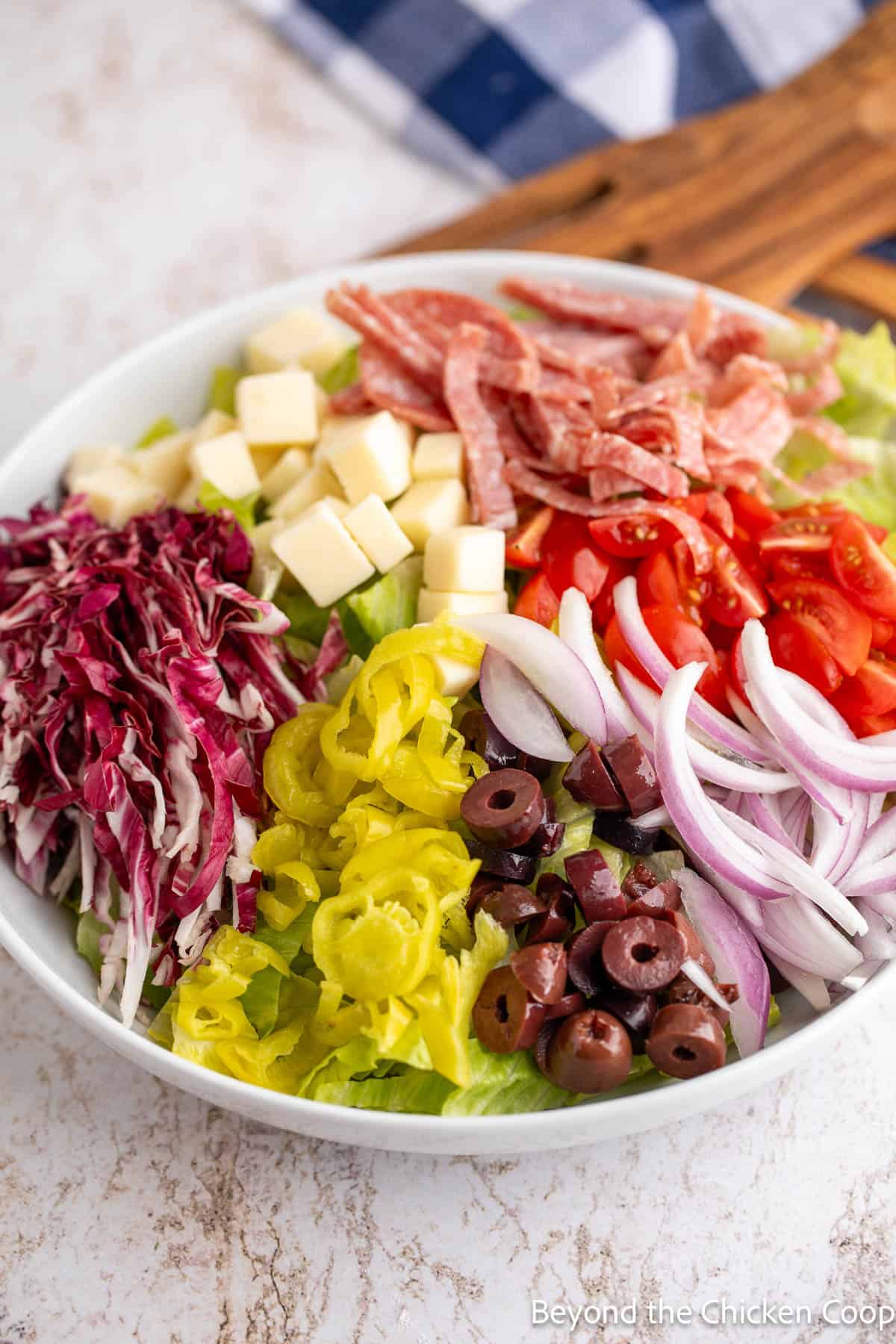 Salad ingredients organized in a bowl. 