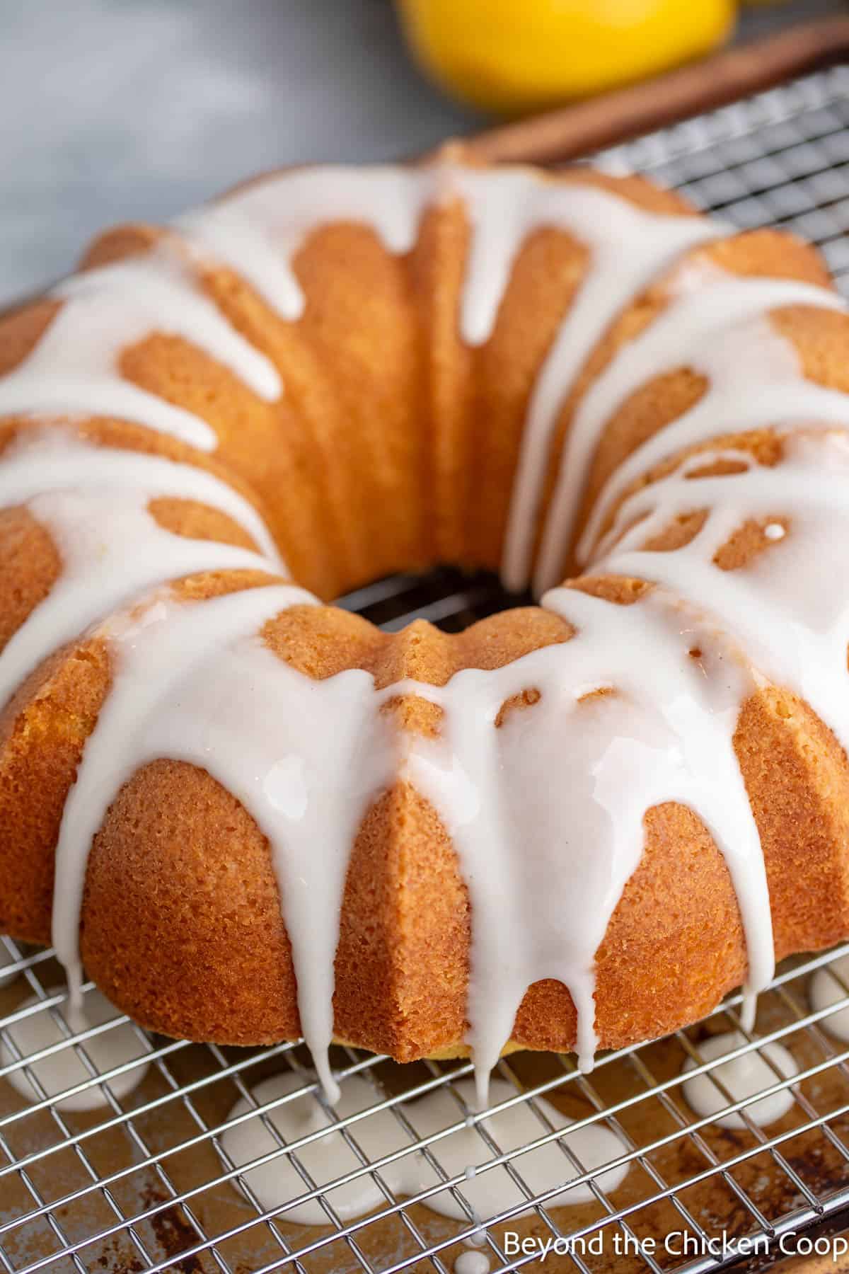 Freshly poured glaze dripping off of a bundt cake. 
