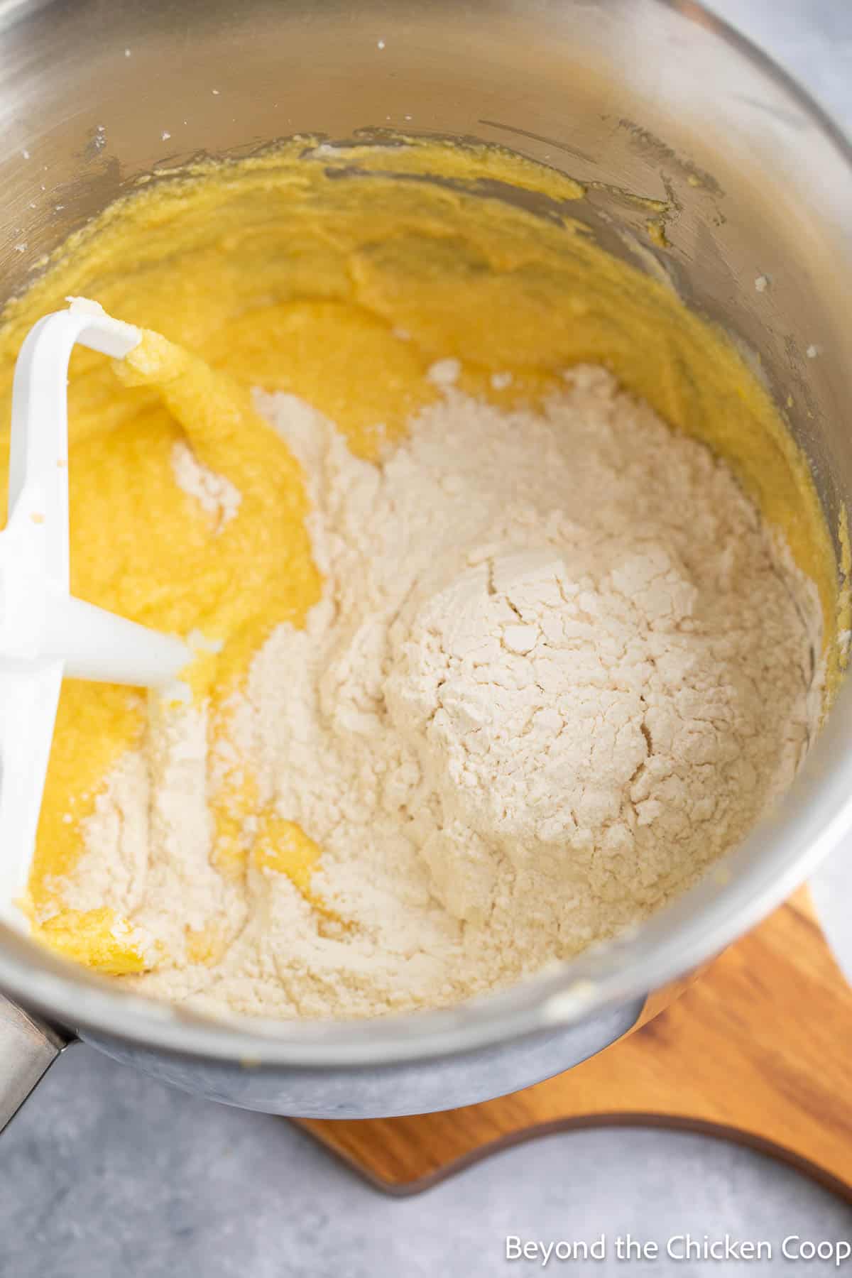 Mixing flour into cake batter. 