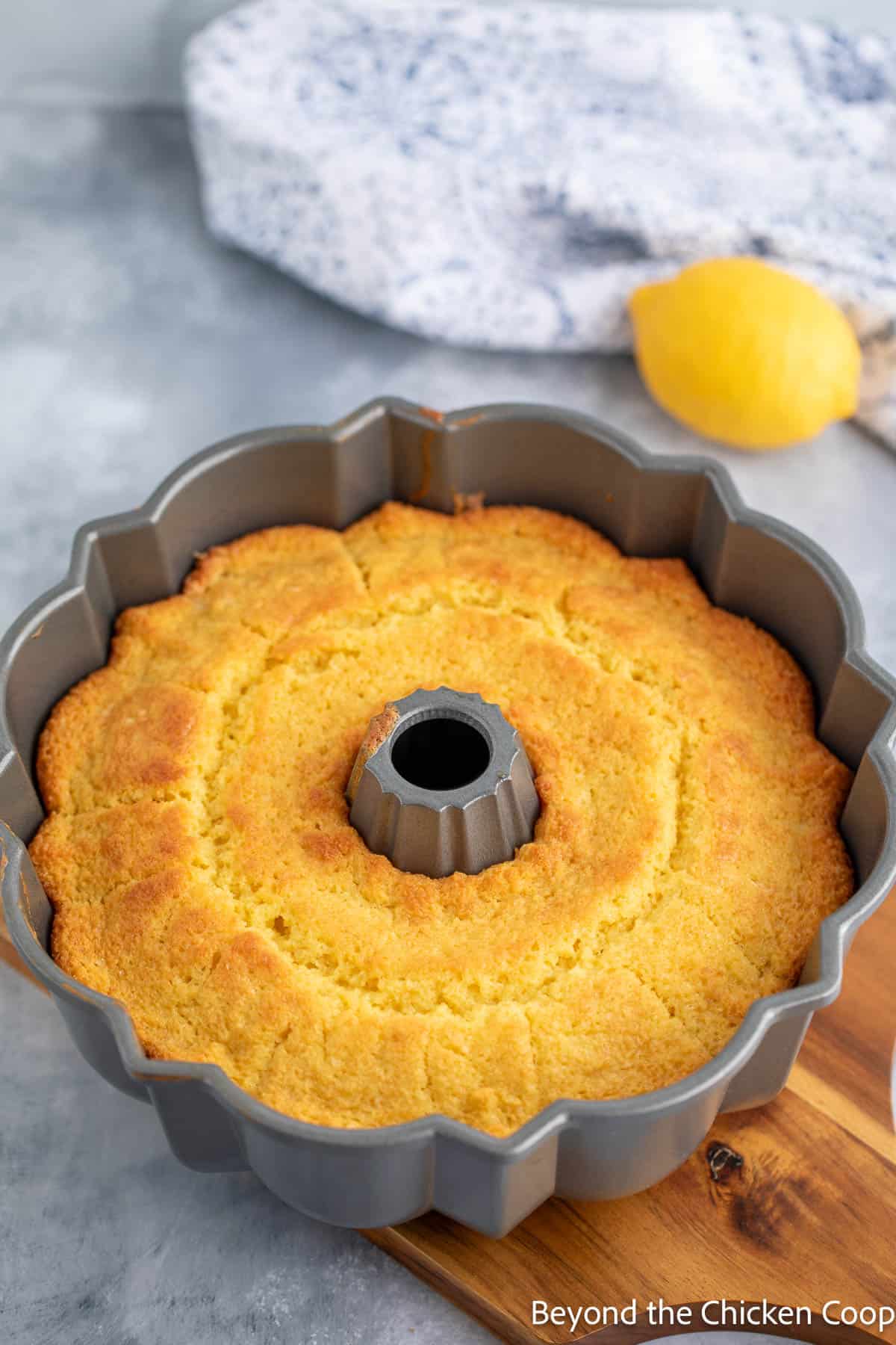 A baked lemon cake in a bundt pan. 