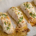 Baked halibut on a baking sheet.