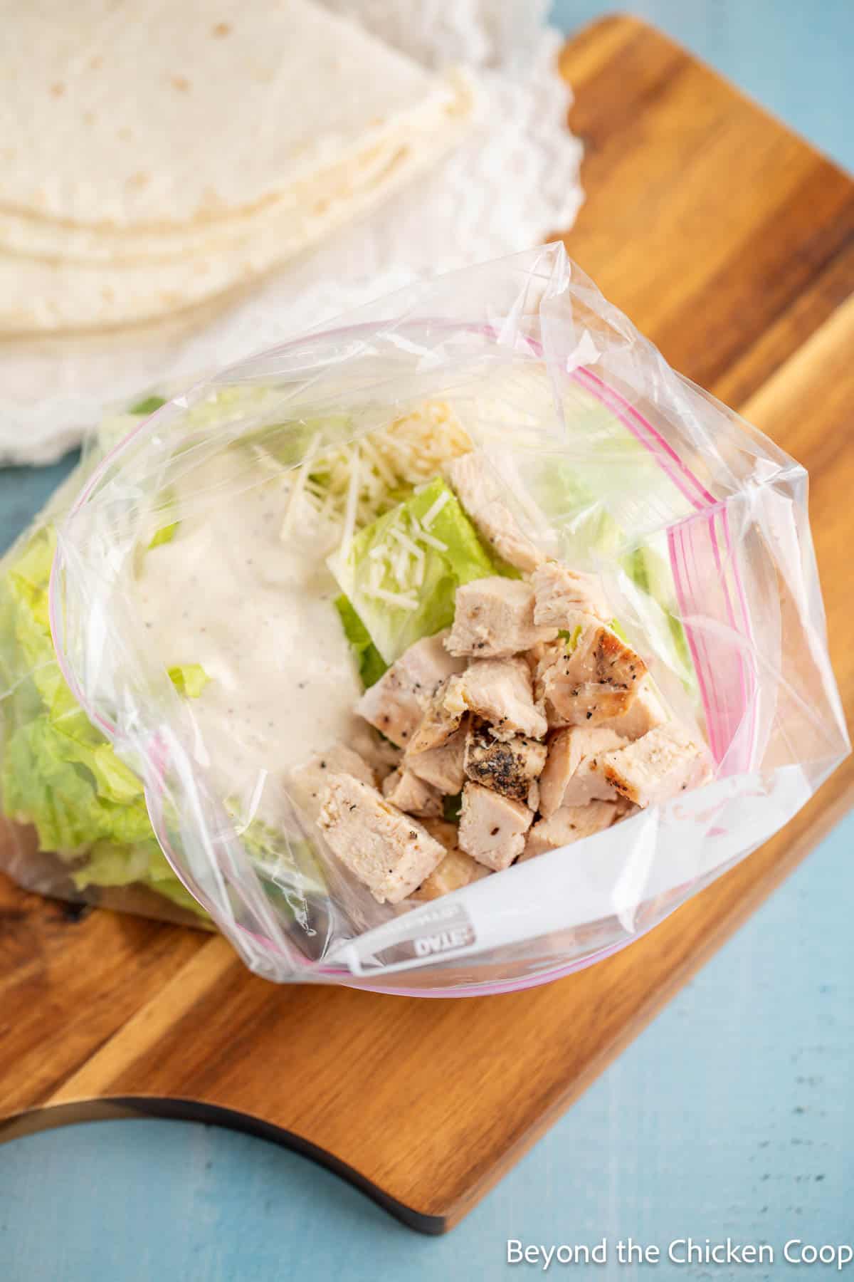 Salad ingredients in a zip top bag. 
