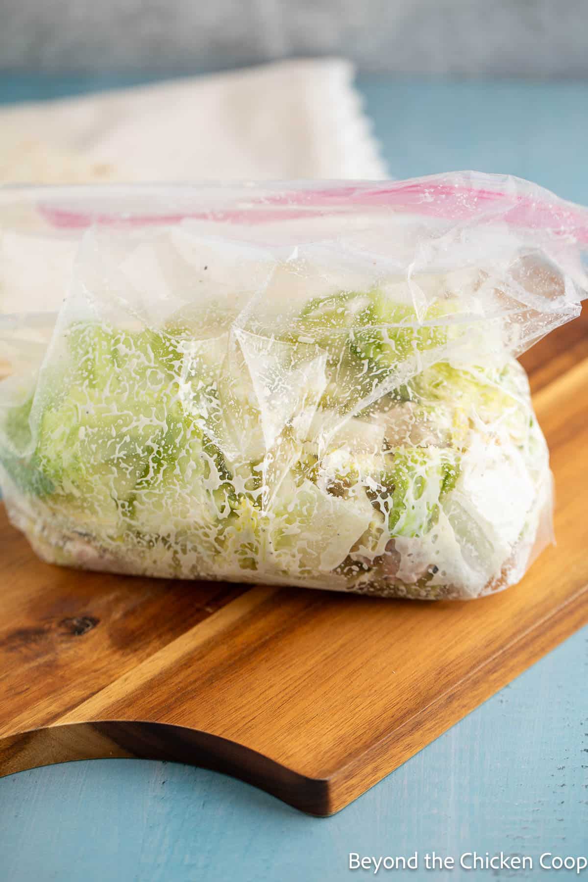 Mixed chicken Caesar in a plastic bag. 
