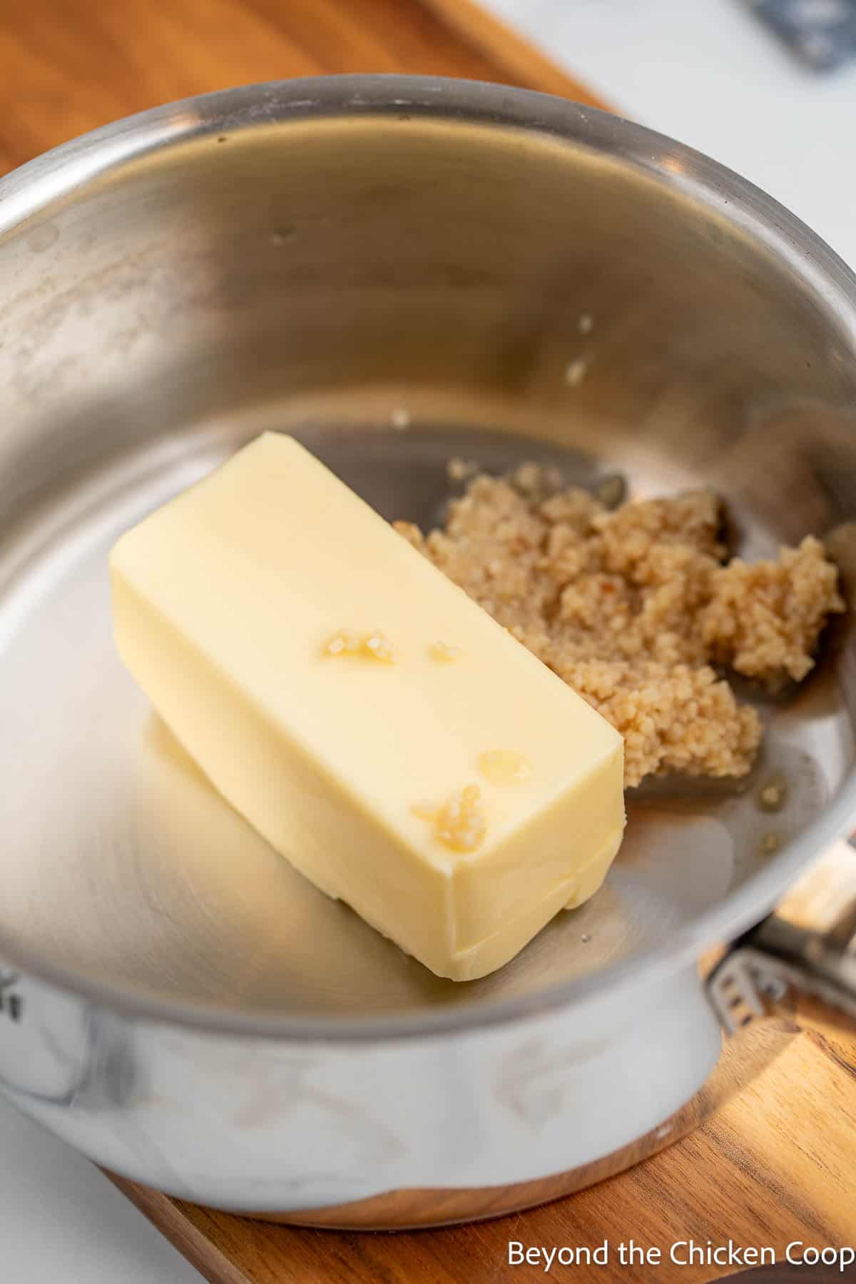 Butter with garlic in a saucepan. 