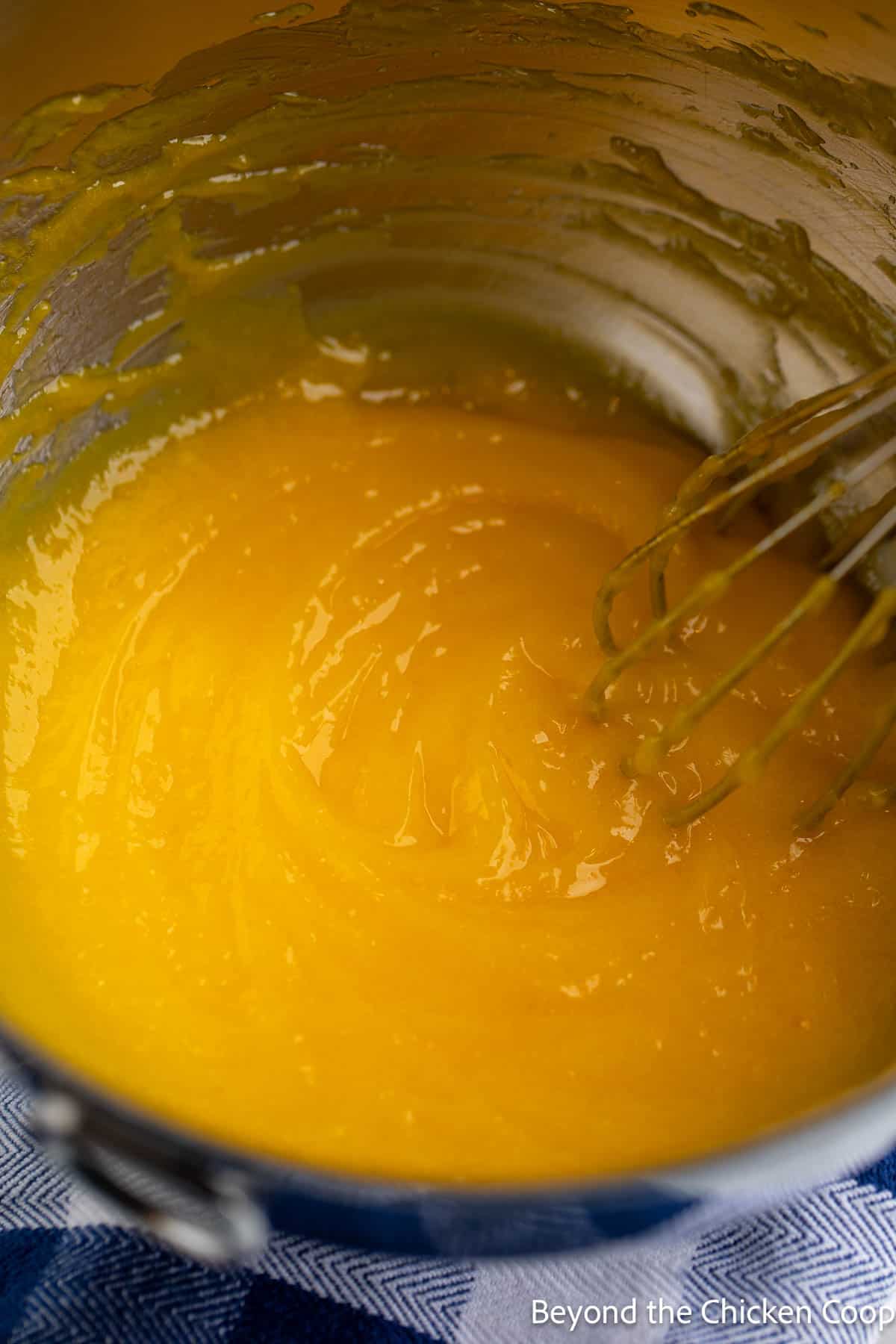 Lemon curd in a metal bowl. 