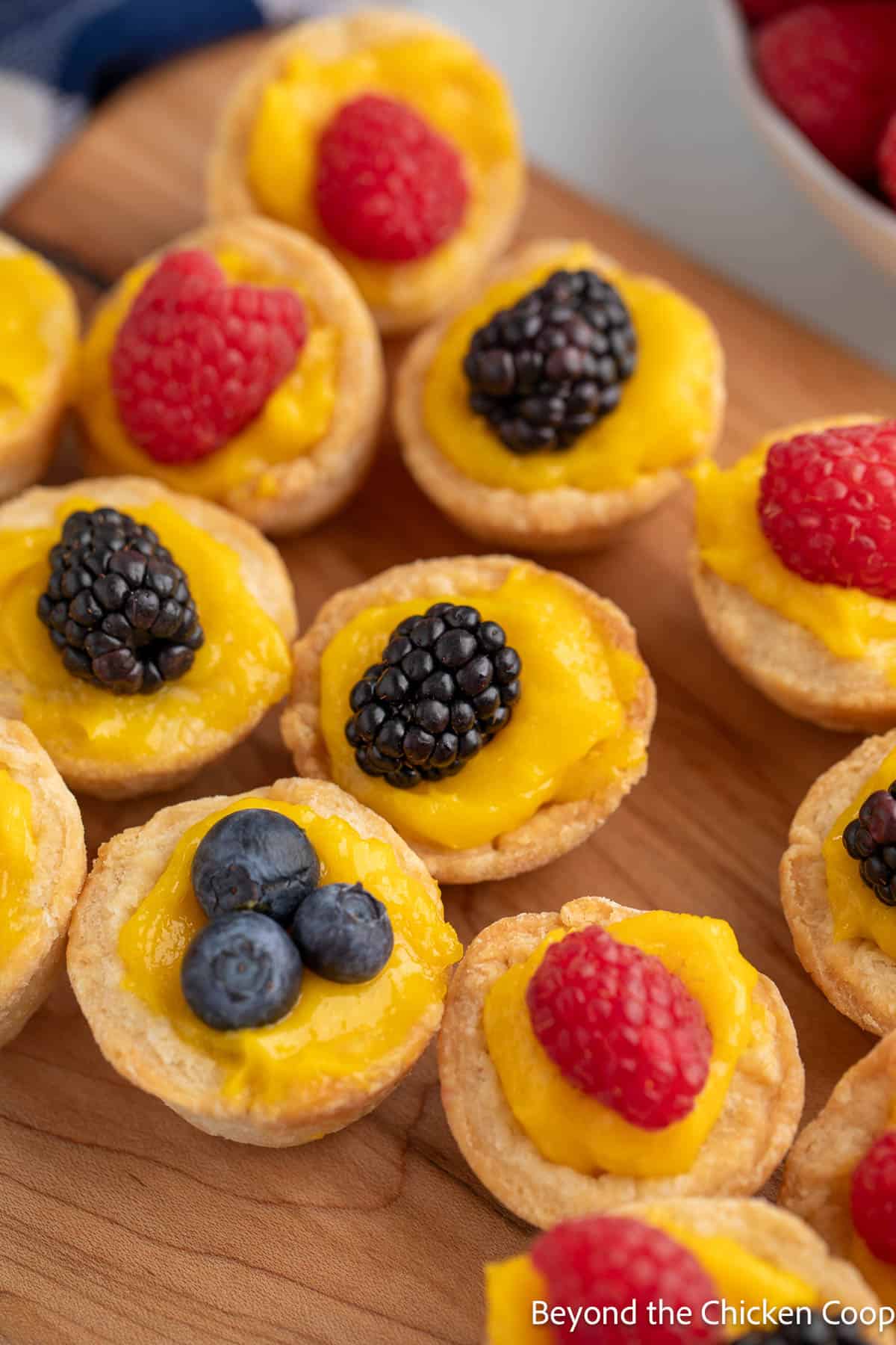 Mini Lemon Tartlets topped with berries. 