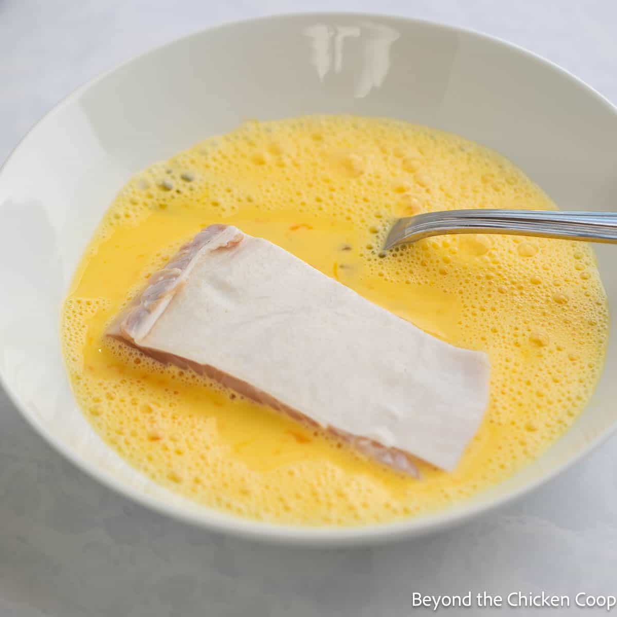 Halibut filled in an egg and milk dip. 